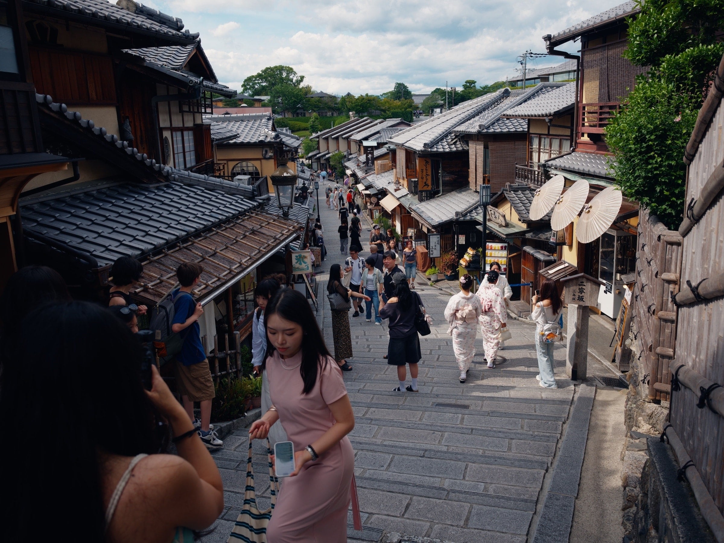 A photograph of a busy street in Kyoto, Japan.